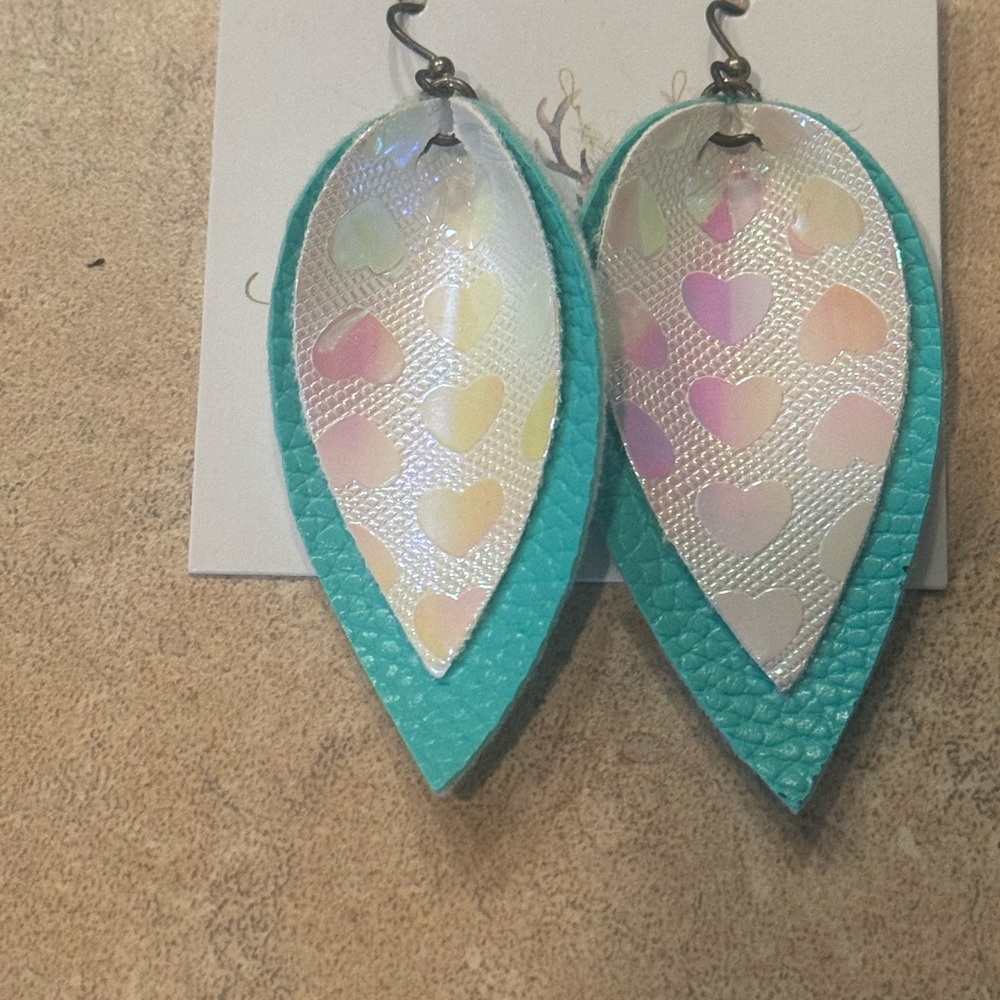 Two layer earrings. Top layered is iridescent heart print